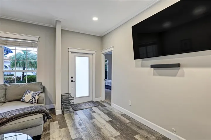 Entryway featuring wood finished floors and recessed lighting