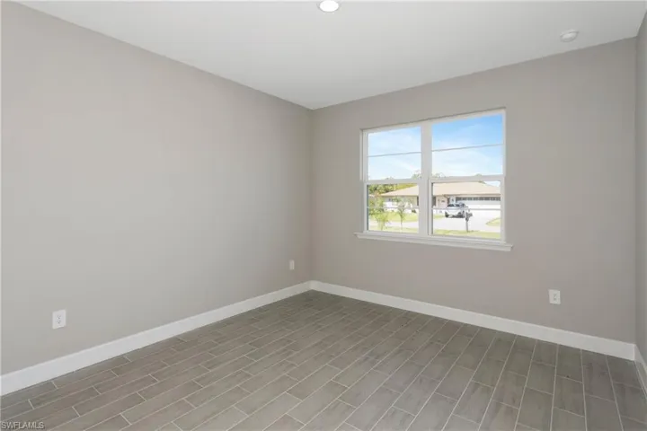 Spare room featuring hardwood / wood-style floors