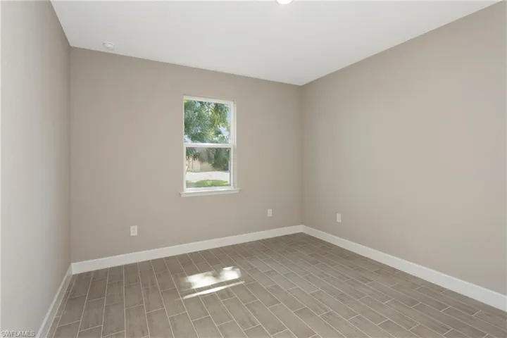 Empty room featuring light hardwood / wood-style flooring