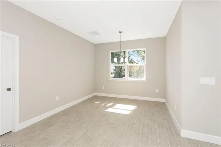 Spare room featuring light hardwood / wood-style flooring