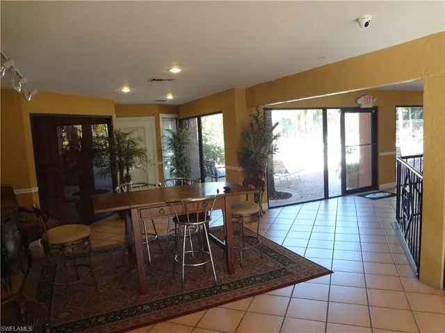 Dining space featuring a healthy amount of sunlight and light tile patterned floors
