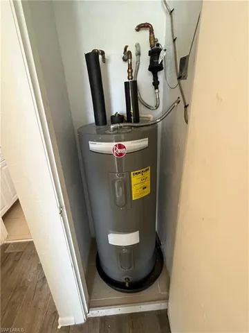 Utility room featuring electric water heater