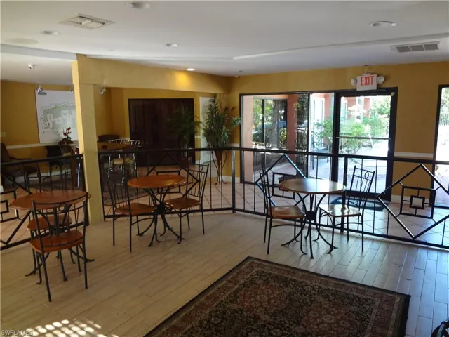 Dining area with wood-type flooring
