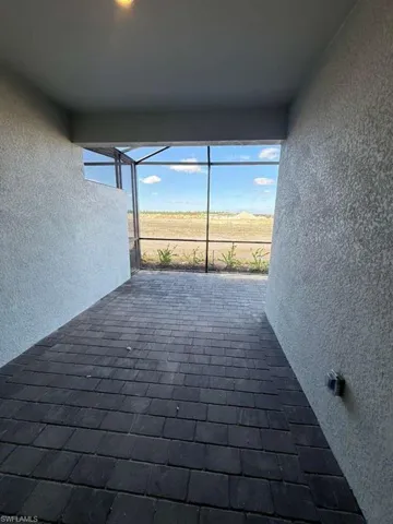 View of patio / terrace with a sunroom and a lanai