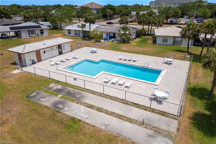 Community pool featuring a patio