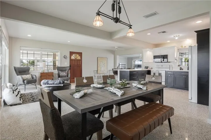 Dining area featuring beam ceiling