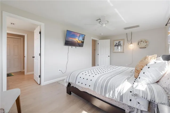 Bedroom featuring light wood-type flooring and ceiling fan