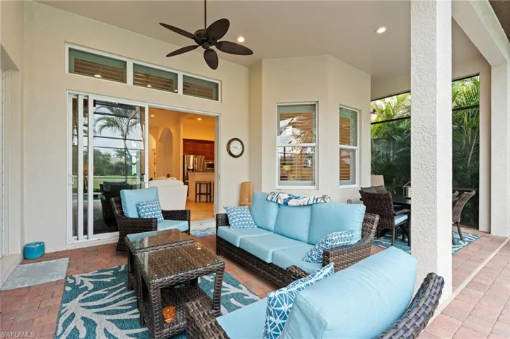 View of patio featuring an outdoor hangout area and a ceiling fan