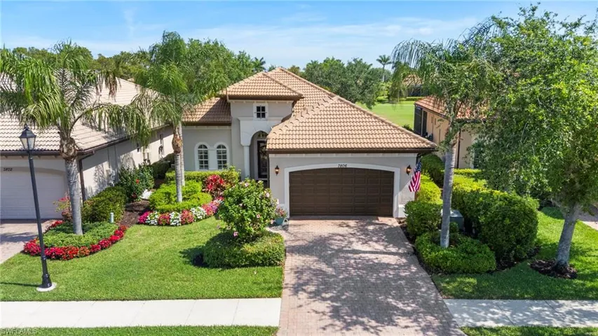 Mediterranean / spanish home featuring a tiled roof, decorative driveway, a garage, and stucco siding