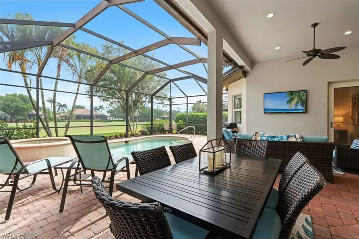 View of patio with an outdoor pool, outdoor dining space, a ceiling fan, an outdoor living space, and a jacuzzi