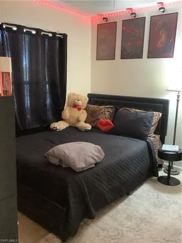 Bedroom with carpet flooring