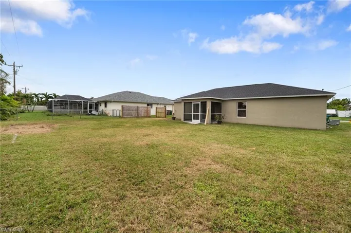 View of yard featuring a sunroom