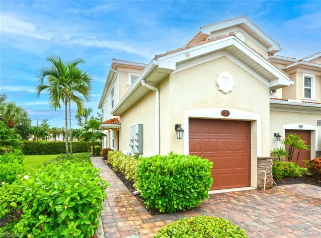 View of property exterior featuring a garage