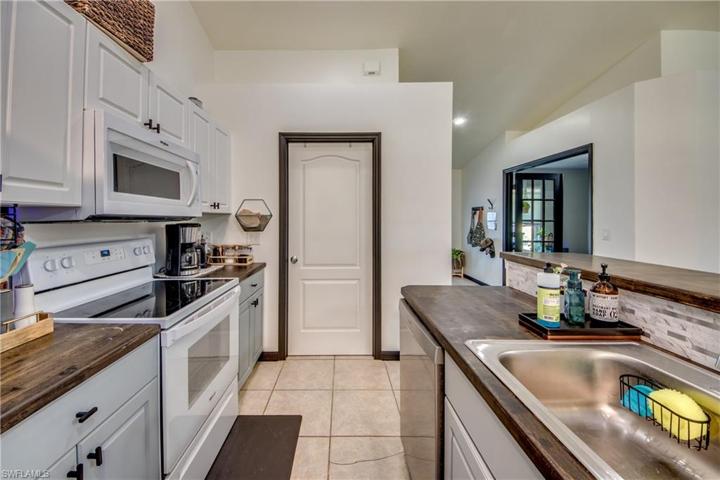Laundry room and garage located through that door