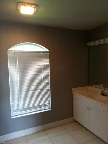 Bathroom with vanity and tile floors