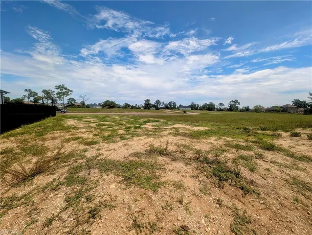 View of the vacant lot from the back of the property