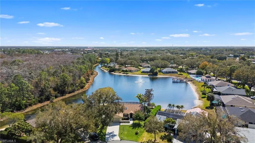Aerial perspective of suburban area with a large body of water