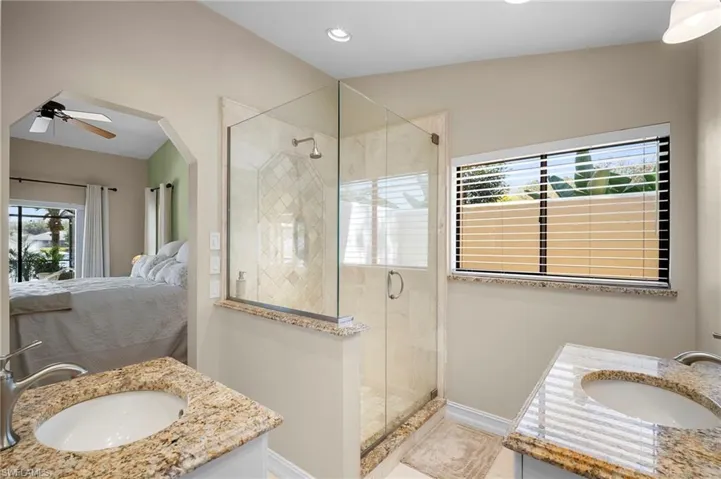Full bathroom featuring vanity and a stall shower