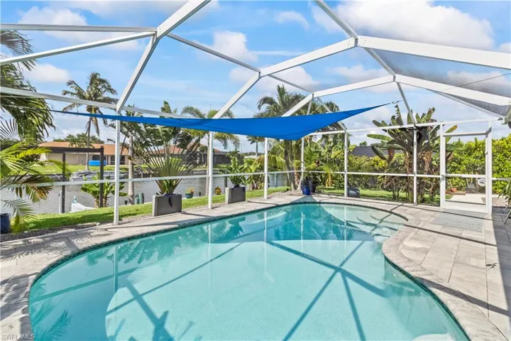 Swimming pool, ceiling fan, and a patio area