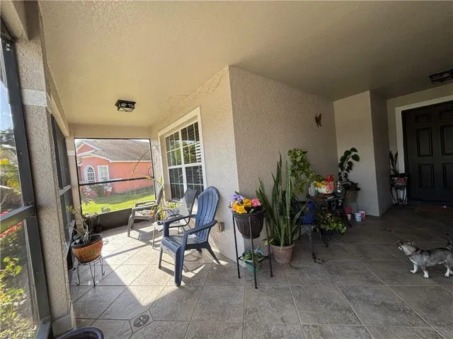 View of patio / terrace featuring a sunroom
