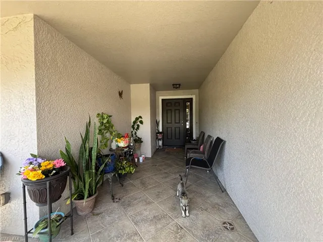 View of exterior entry with stucco siding