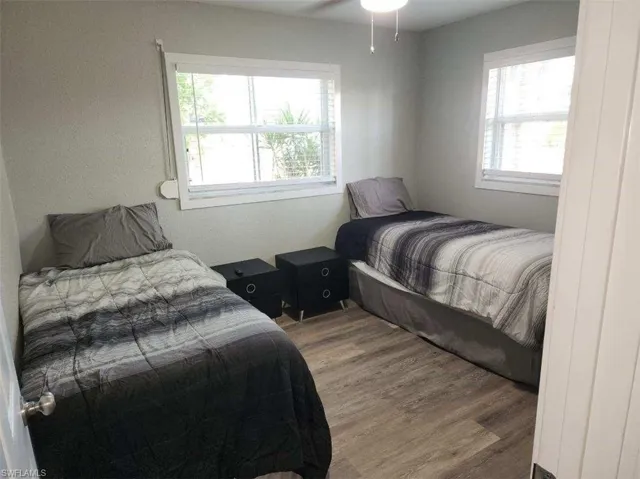Bedroom with wood-type flooring and ceiling fan