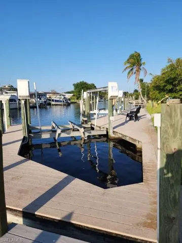 Dock area featuring a water view