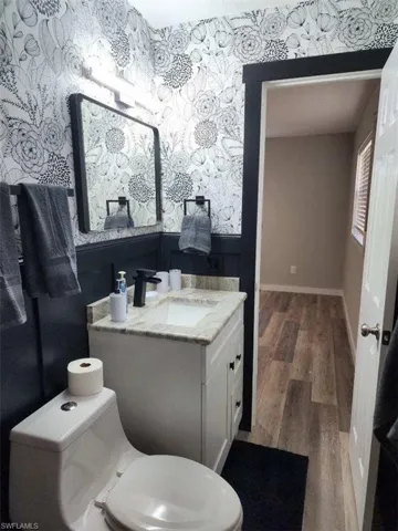 Bathroom with vanity and hardwood / wood-style floors