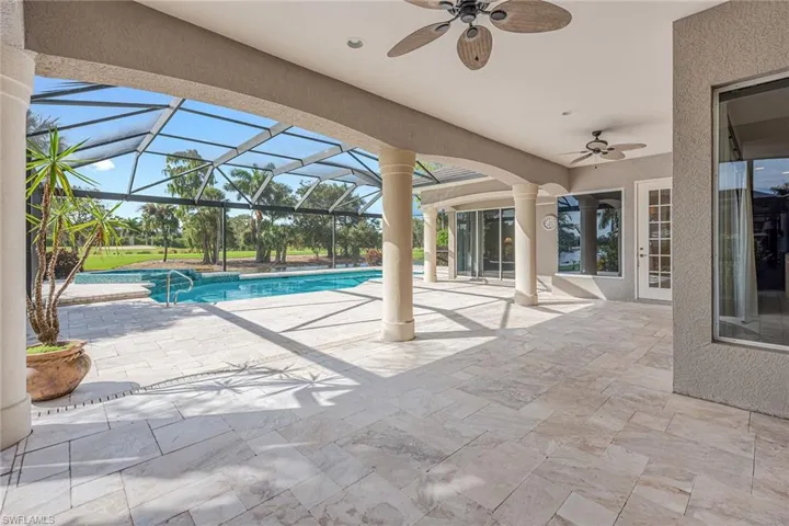 Outdoor pool with a patio, ceiling fan, a sunroom, and a lanai