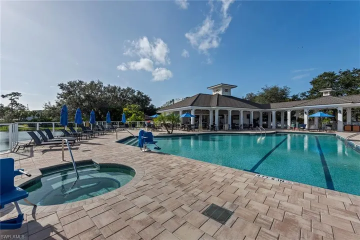 Community pool with a patio and a community hot tub