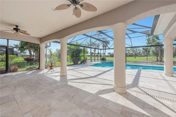 View of pool featuring a ceiling fan, a sunroom, a patio area, and a lanai
