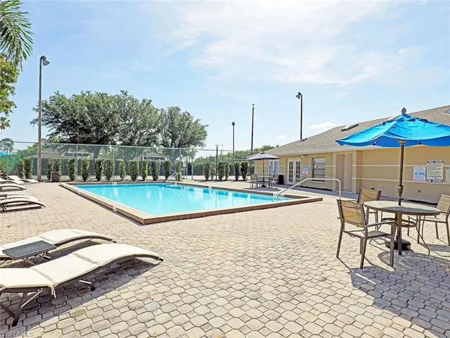 Community pool featuring a patio area
