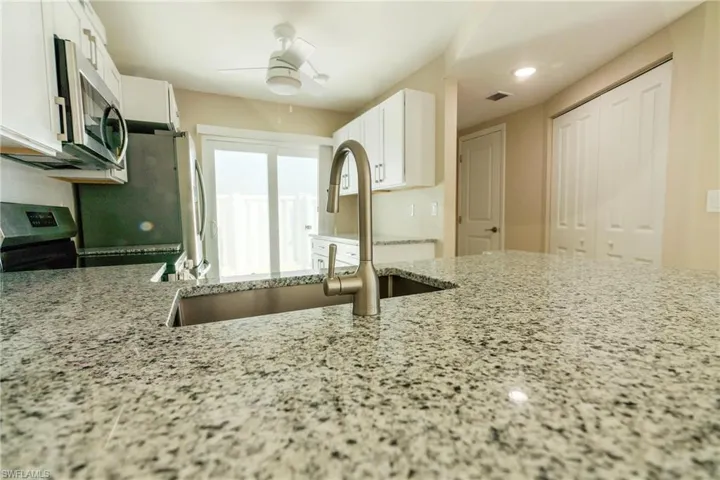 Kitchen to courtyard, powder room and laundry area to the right