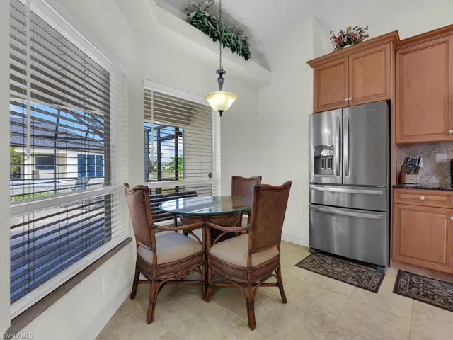 Dining area featuring baseboards and light tile patterned floors