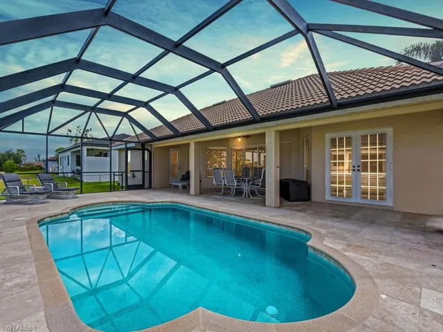 Outdoor pool featuring a patio, french doors, and a lanai