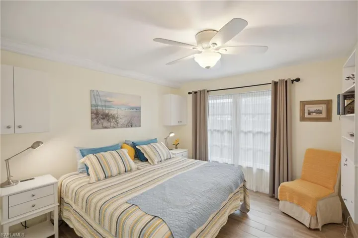 Bedroom featuring light hardwood / wood-style flooring and ceiling fan