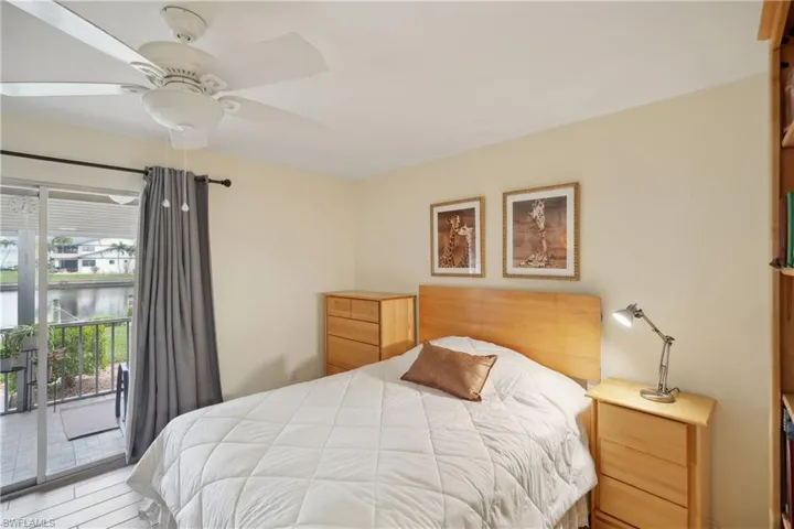 Bedroom with access to outside and ceiling fan