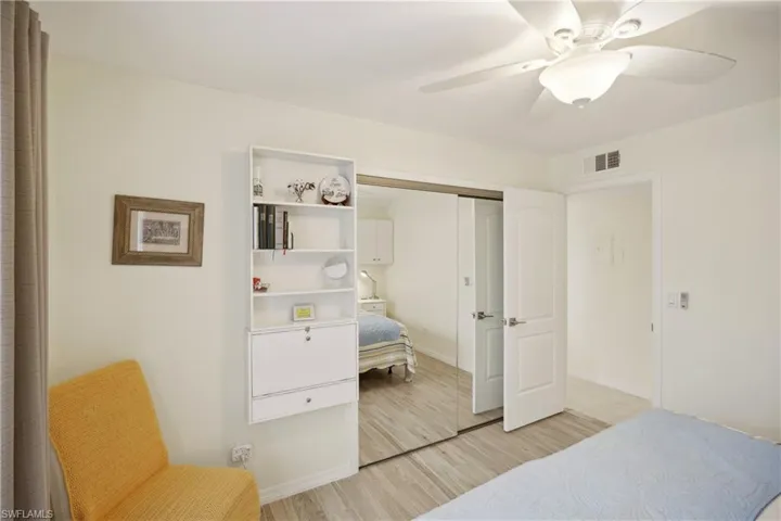 Bedroom with ceiling fan and a closet