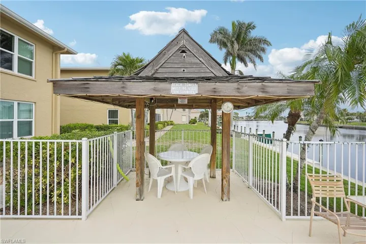 View of patio with a gazebo and a water view