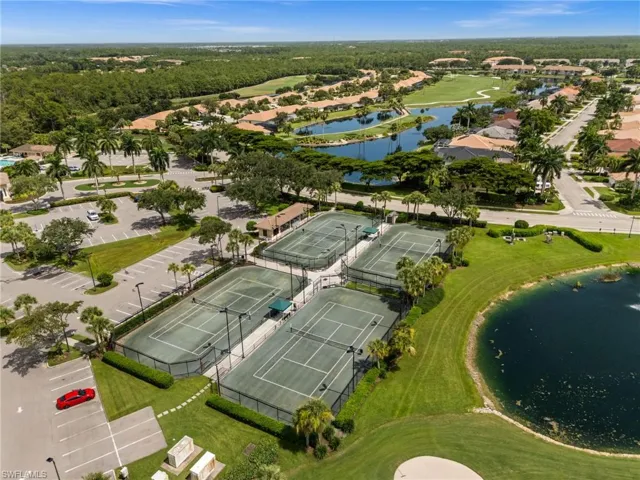 Community tennis courts featuring four distinct playing surfaces with surrounding fencing