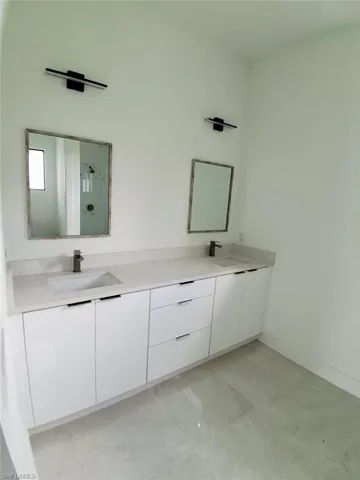 Bathroom featuring double vanity