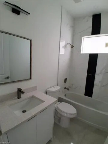 Bathroom 2 with vanity, shower / tub combination