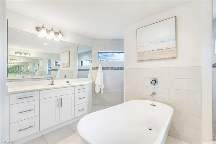 Dueling Vanties and modern soak tub