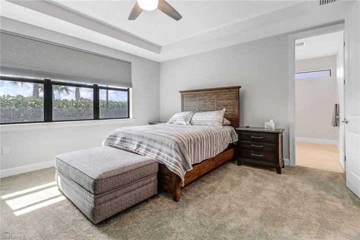 Bedroom with carpet and ceiling fan