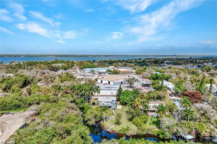 Bird's eye view of a large body of water and a tree filled landscape