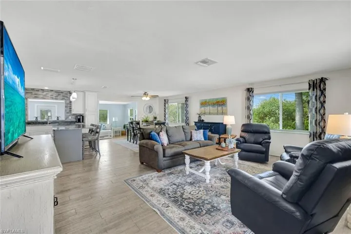 Living room featuring light wood-style floors and ceiling fan