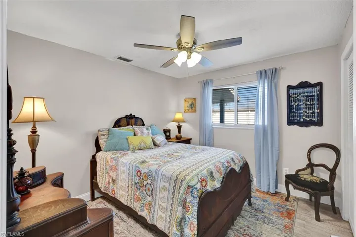 Bedroom with baseboards and ceiling fan