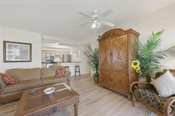 Living room with wood finish floors and ceiling fan