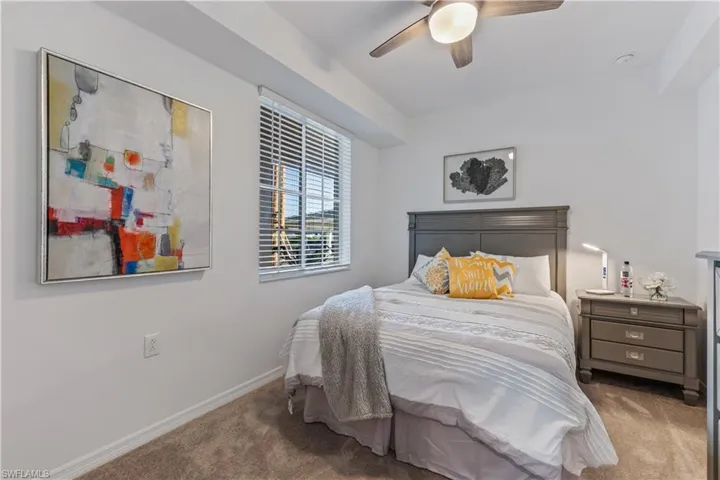 Bedroom with carpet and ceiling fan