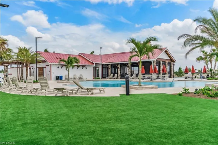 View of pool with a yard and a patio area